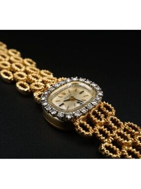 Rolex Ladies Gold Bracelet Watch with Diamond Halo